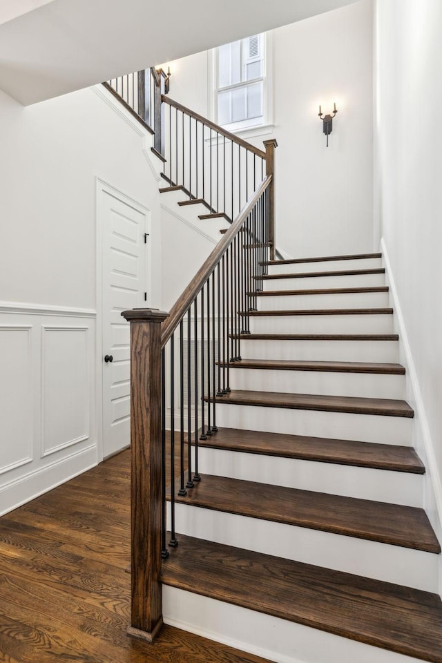 stairway featuring wood-type flooring