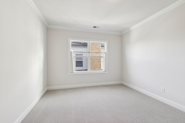 empty room with crown molding and carpet floors