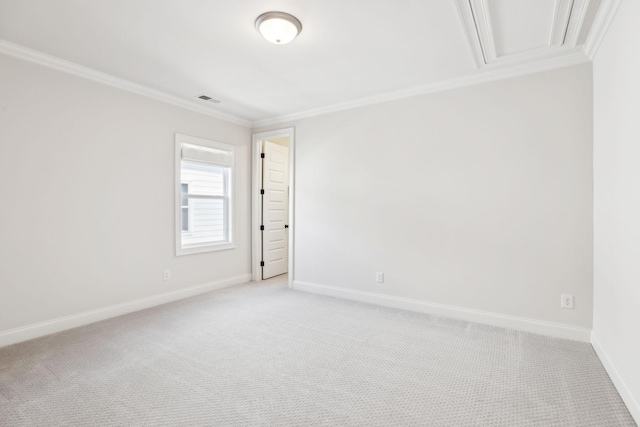 carpeted spare room with ornamental molding