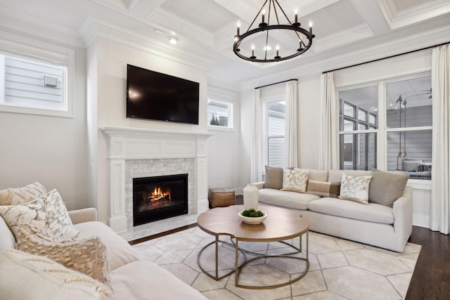 living room with crown molding, coffered ceiling, and beam ceiling