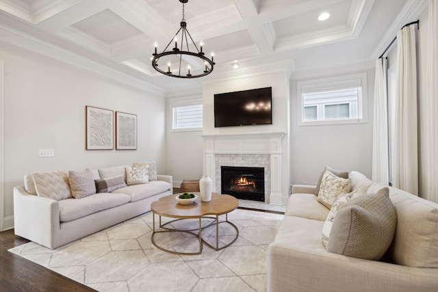 living room featuring beamed ceiling, ornamental molding, coffered ceiling, and light hardwood / wood-style flooring