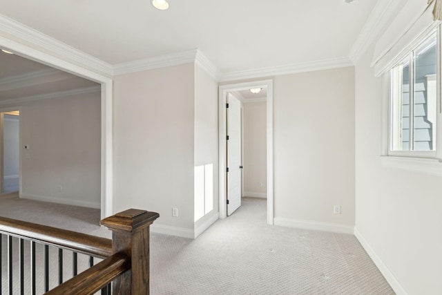 hall with crown molding and light carpet