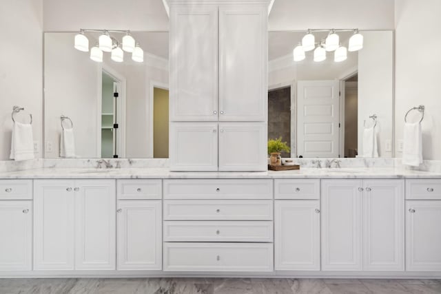 bathroom with vanity and ornamental molding