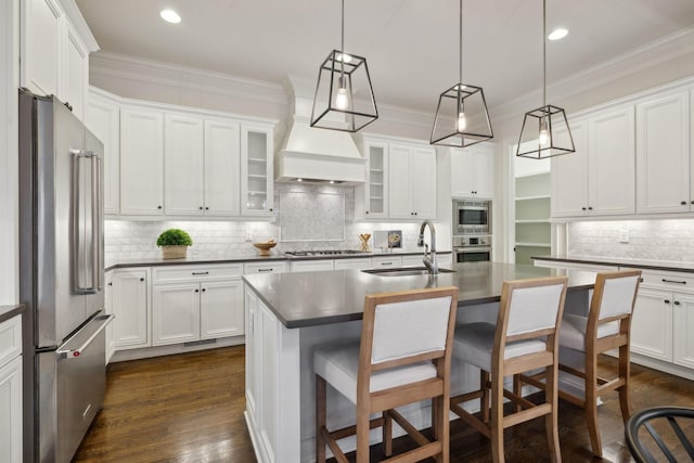 kitchen with white cabinetry, sink, a center island with sink, and appliances with stainless steel finishes