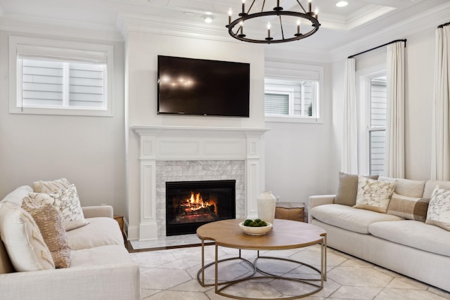 living room with crown molding, a chandelier, and light tile patterned flooring