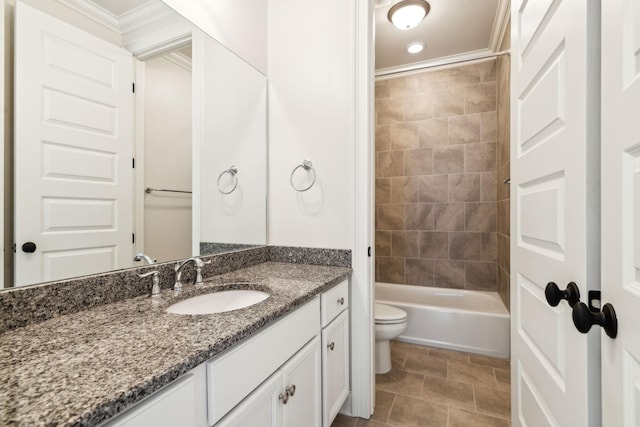 full bathroom with crown molding, tiled shower / bath combo, vanity, tile patterned floors, and toilet