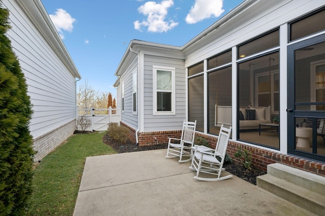 view of patio / terrace with a sunroom