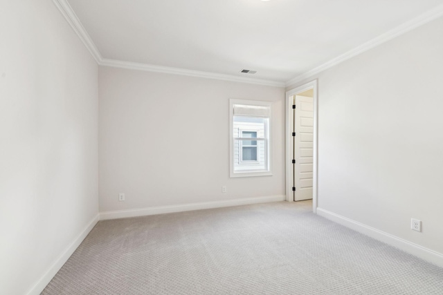 carpeted spare room with ornamental molding