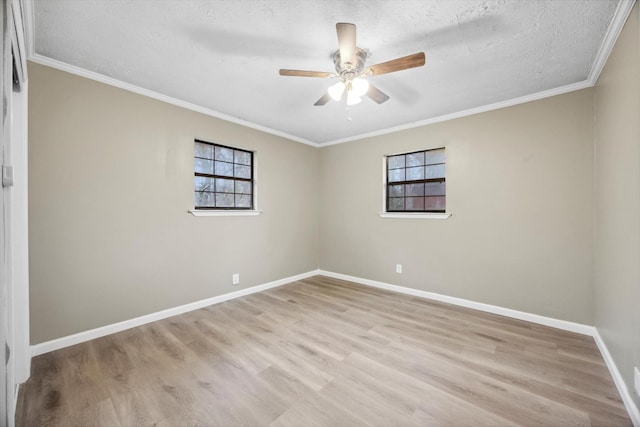 spare room with crown molding, ceiling fan, light hardwood / wood-style flooring, and a textured ceiling