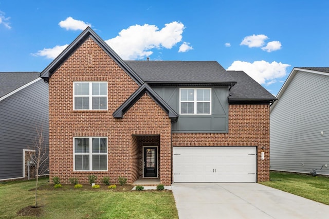 view of front of house with a garage and a front yard