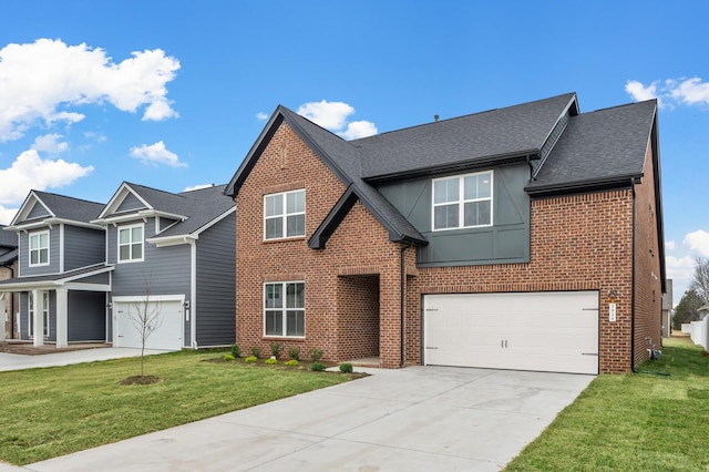 view of front of property featuring a garage and a front yard