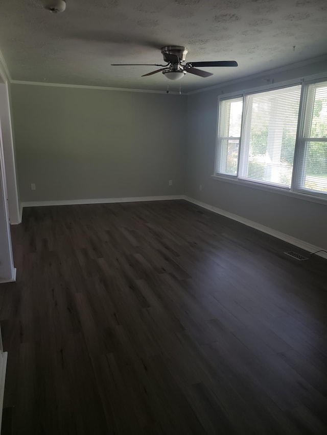 unfurnished room featuring ceiling fan, ornamental molding, and dark hardwood / wood-style flooring