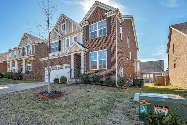 view of front of house featuring a garage and a front lawn