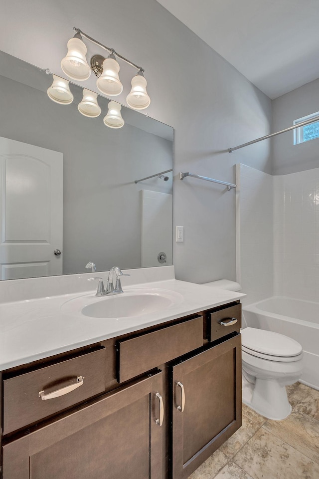 full bathroom featuring vanity, bathtub / shower combination, and toilet