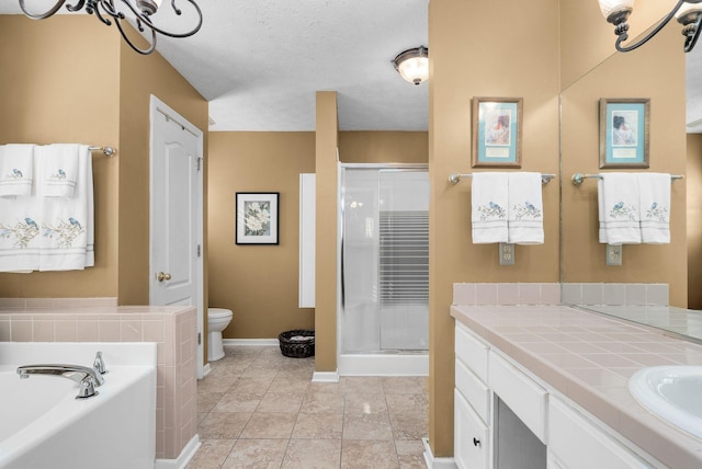 full bathroom with vanity, shower with separate bathtub, a textured ceiling, and toilet