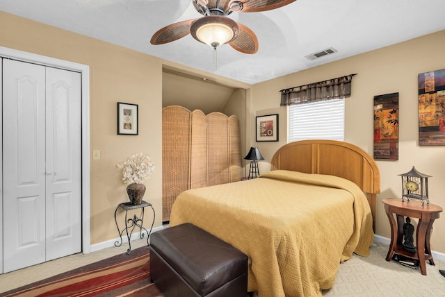 bedroom with a closet, ceiling fan, and carpet