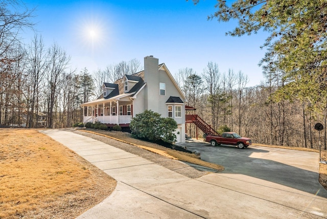 view of property exterior featuring covered porch