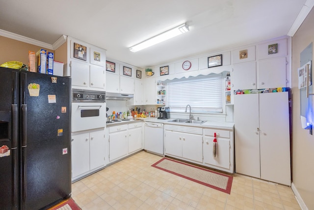 kitchen featuring crown molding, sink, white cabinets, and white appliances