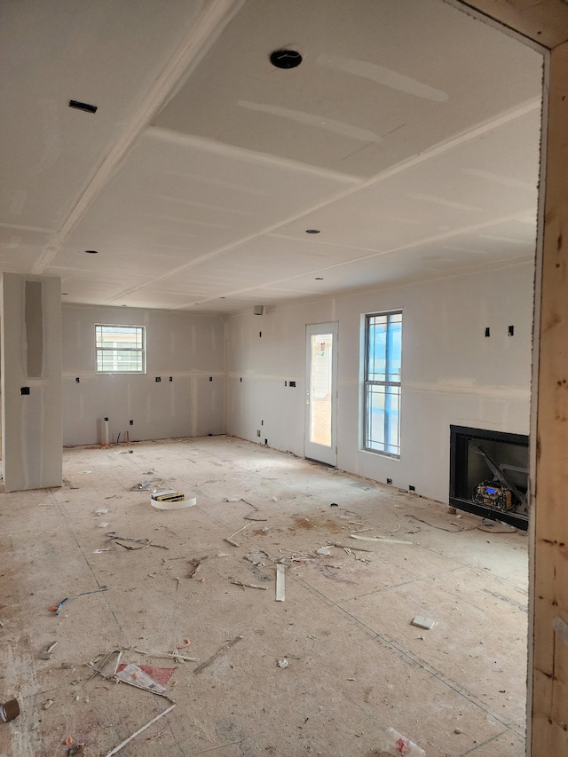 unfurnished living room featuring a fireplace