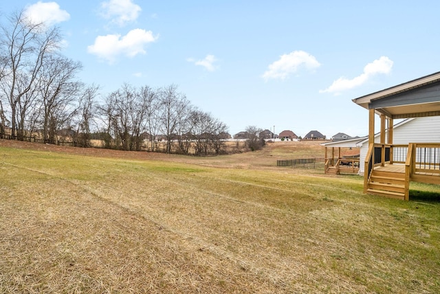 view of yard with a wooden deck