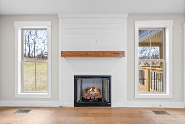 interior details with a large fireplace and visible vents