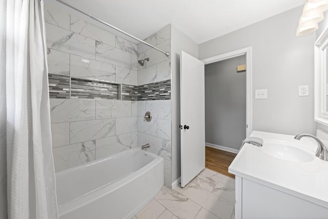 bathroom with vanity and shower / bath combo