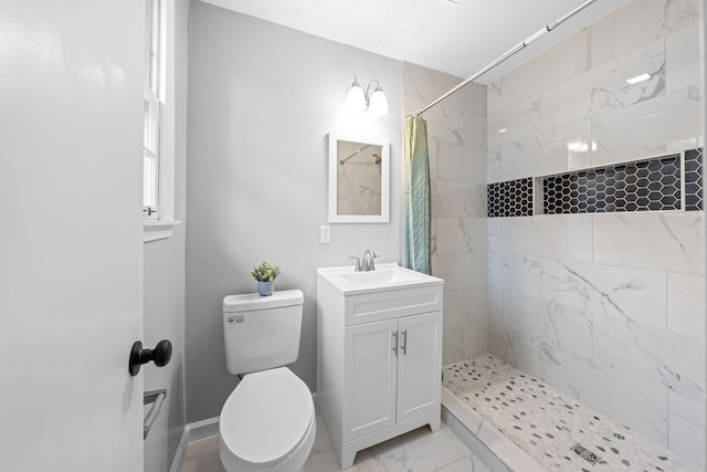 bathroom with vanity, curtained shower, and toilet