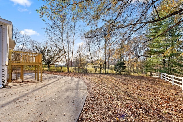 view of yard featuring a patio and a deck