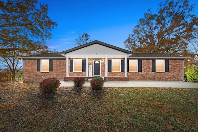 ranch-style house with a front lawn