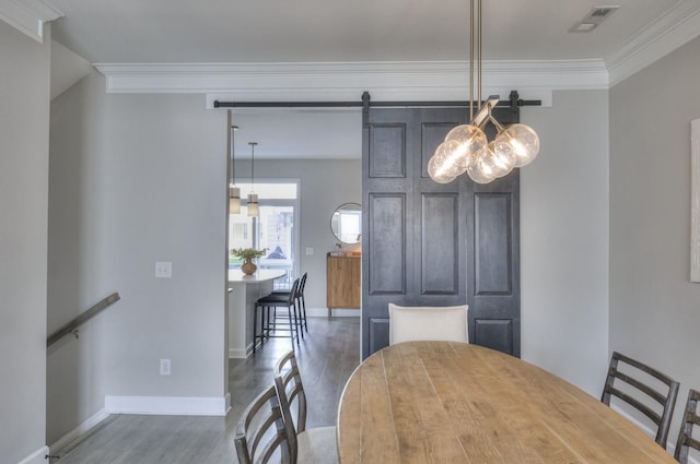 dining space featuring dark hardwood / wood-style flooring and crown molding