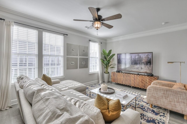 living room with crown molding, hardwood / wood-style floors, and ceiling fan