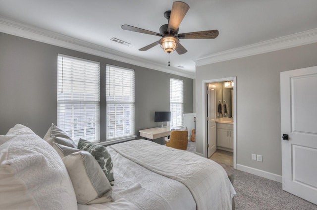 bedroom with crown molding, ensuite bath, light colored carpet, and ceiling fan