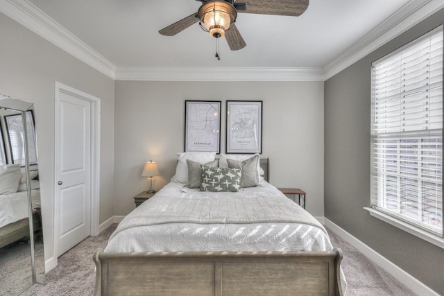 bedroom featuring crown molding, light colored carpet, and ceiling fan