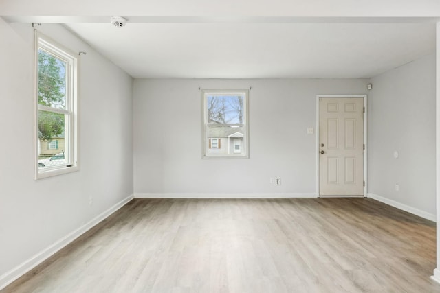 spare room featuring light hardwood / wood-style flooring