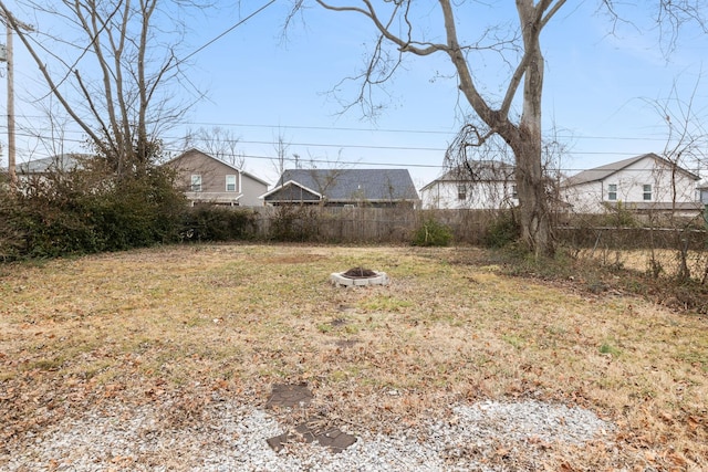 view of yard with an outdoor fire pit