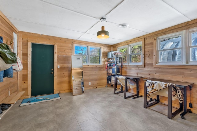 miscellaneous room with wooden walls