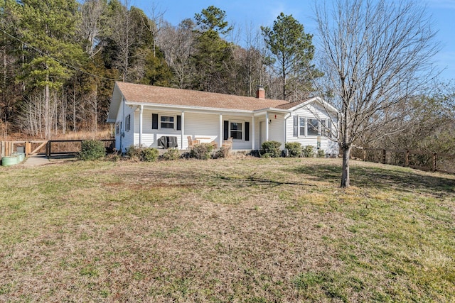 ranch-style house with a porch and a front lawn