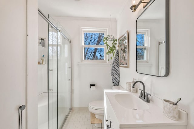 bathroom featuring walk in shower, toilet, crown molding, vanity, and tile patterned flooring