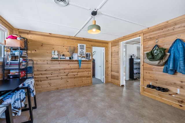 interior space featuring wooden walls