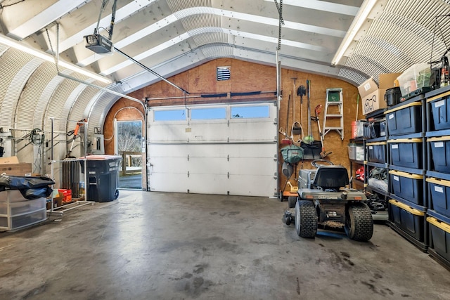 garage featuring a garage door opener and electric panel