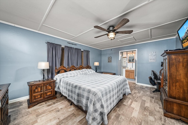 bedroom with connected bathroom, ceiling fan, and light hardwood / wood-style flooring