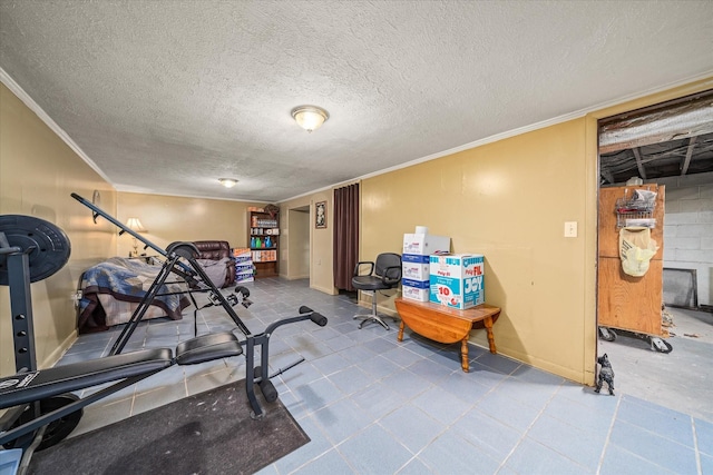 exercise room with ornamental molding and a textured ceiling