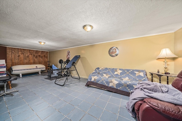 bedroom featuring crown molding and a textured ceiling