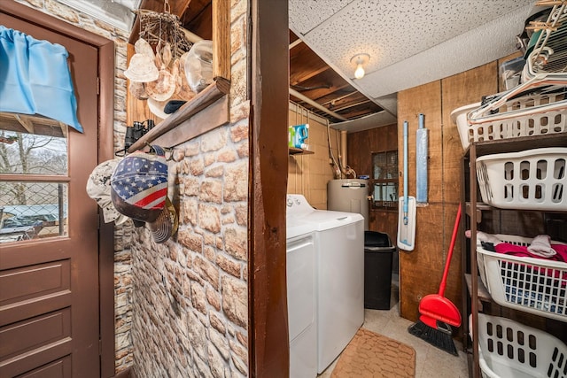 laundry room featuring water heater and separate washer and dryer