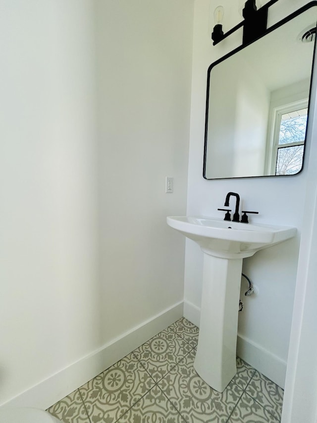 bathroom with tile patterned floors