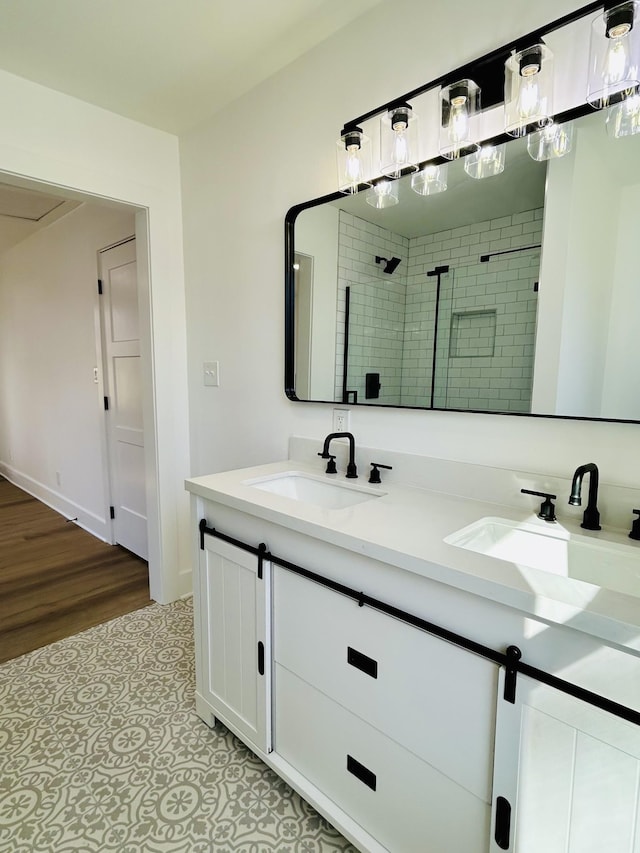 bathroom featuring vanity and a tile shower