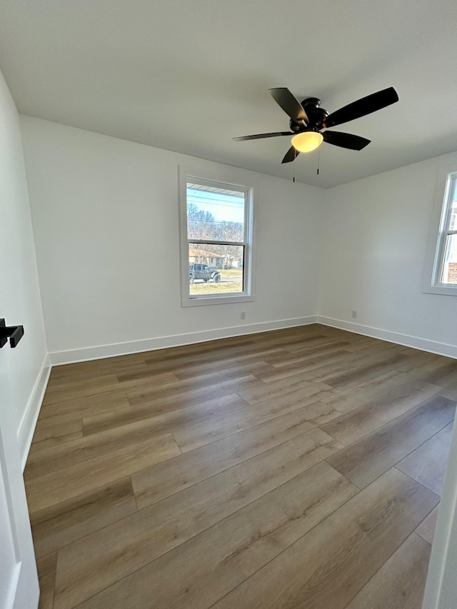 unfurnished room featuring ceiling fan and light wood-type flooring