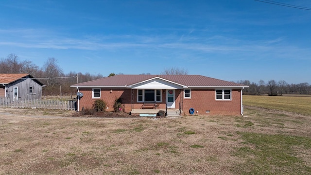 rear view of house with a lawn