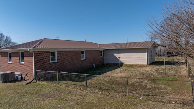 view of property exterior with cooling unit and a yard