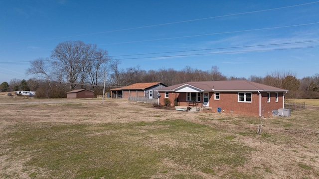 rear view of property with a yard